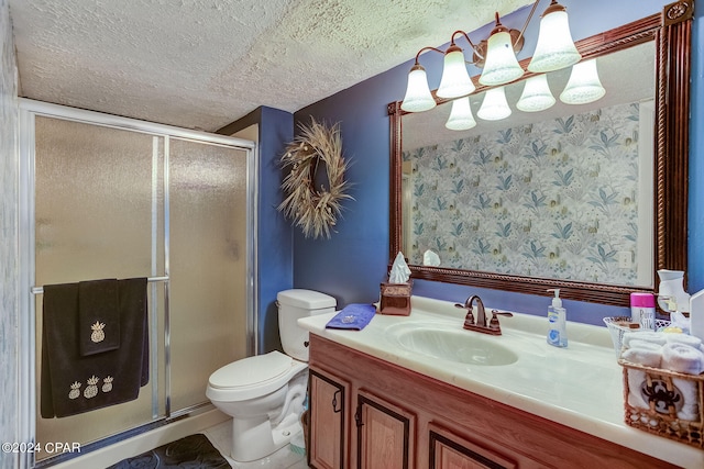 bathroom with a shower with shower door, toilet, tile flooring, and vanity