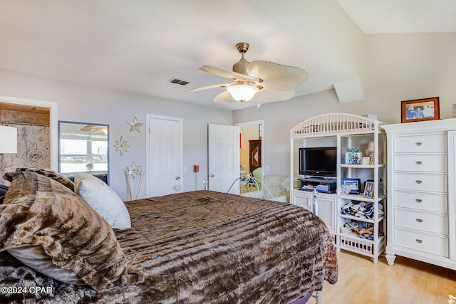 bedroom featuring light hardwood / wood-style floors and ceiling fan