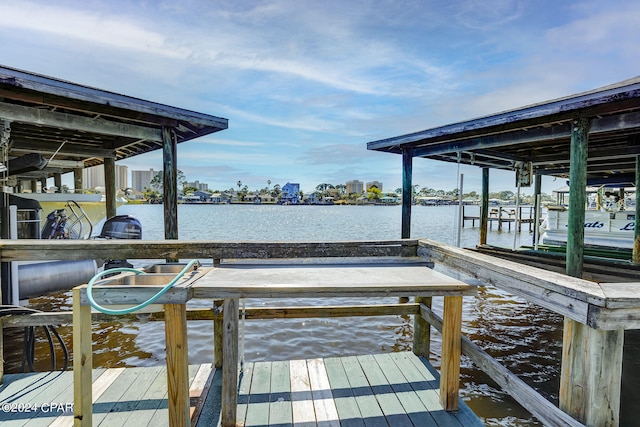 view of dock with a water view