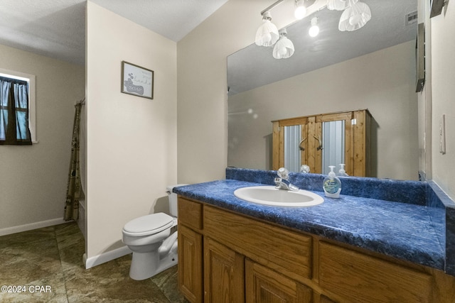 bathroom featuring toilet, tile flooring, and vanity