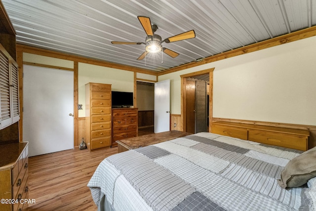 bedroom featuring hardwood / wood-style floors, ceiling fan, and wood ceiling