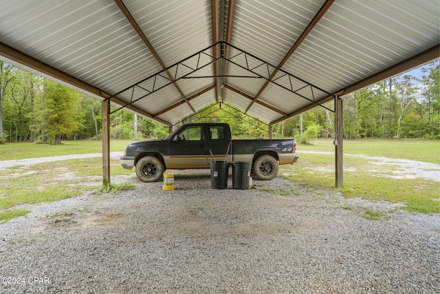 view of parking with a carport and a lawn