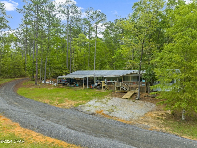 view of front of home featuring a carport