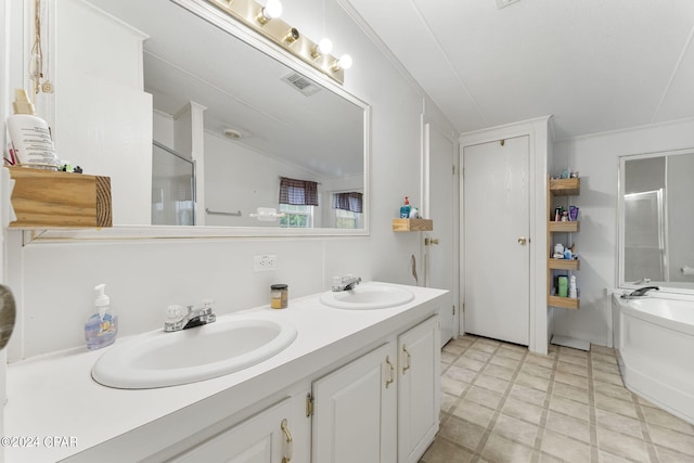 bathroom with oversized vanity, a bathing tub, double sink, and tile flooring