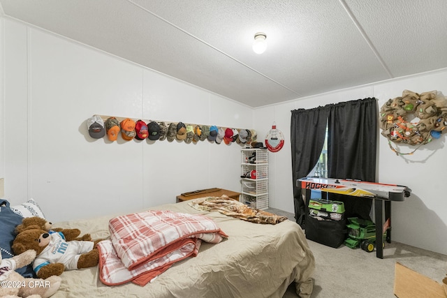 bedroom featuring carpet floors, a textured ceiling, and lofted ceiling