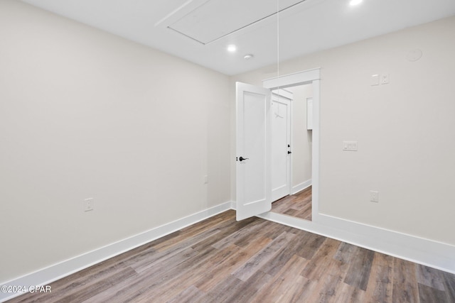 spare room featuring hardwood / wood-style floors