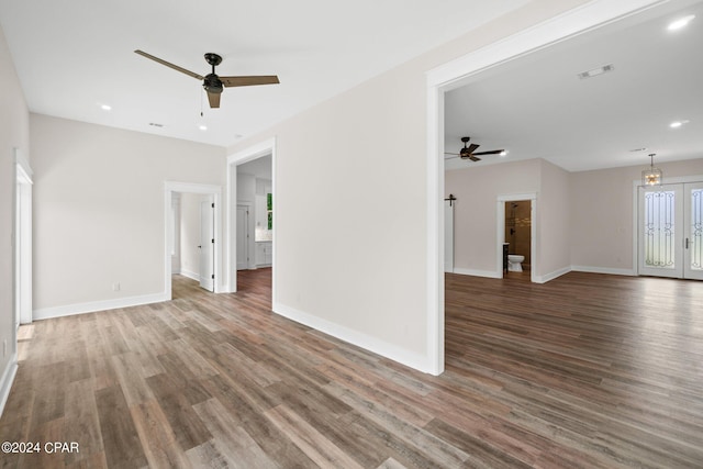 unfurnished living room featuring wood-type flooring and ceiling fan