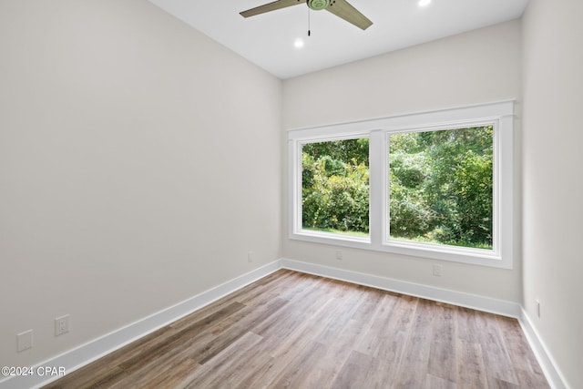 unfurnished room featuring hardwood / wood-style flooring and ceiling fan