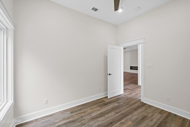 empty room featuring wood-type flooring and ceiling fan