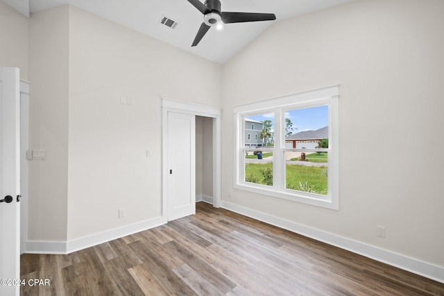 interior space with vaulted ceiling, ceiling fan, and hardwood / wood-style floors