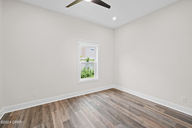 empty room with ceiling fan and hardwood / wood-style floors