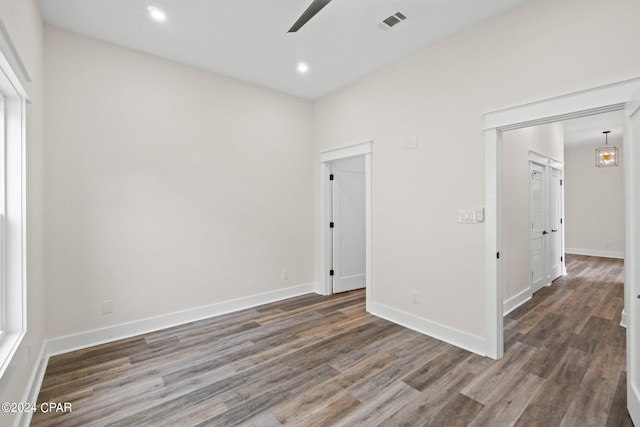 unfurnished room featuring hardwood / wood-style flooring