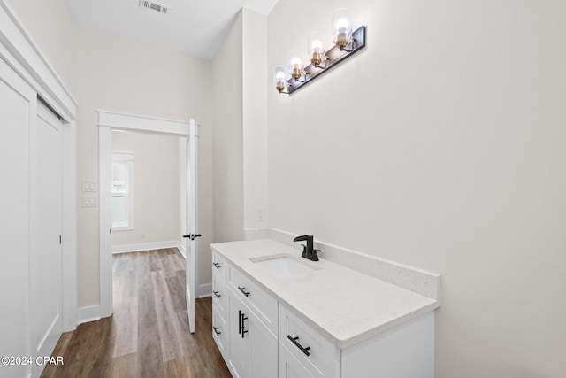 bathroom with wood-type flooring and vanity