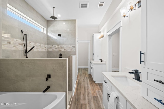 bathroom with vanity and wood-type flooring