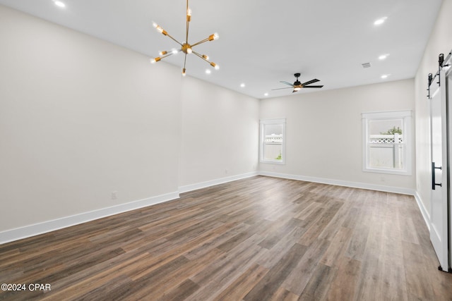 interior space featuring hardwood / wood-style flooring, a barn door, and plenty of natural light