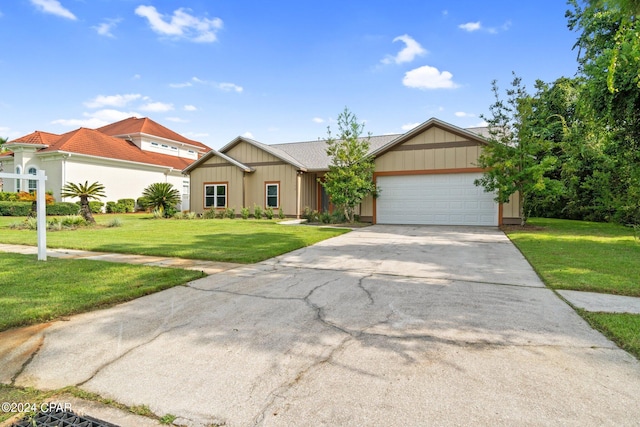 view of front facade with a garage and a front yard