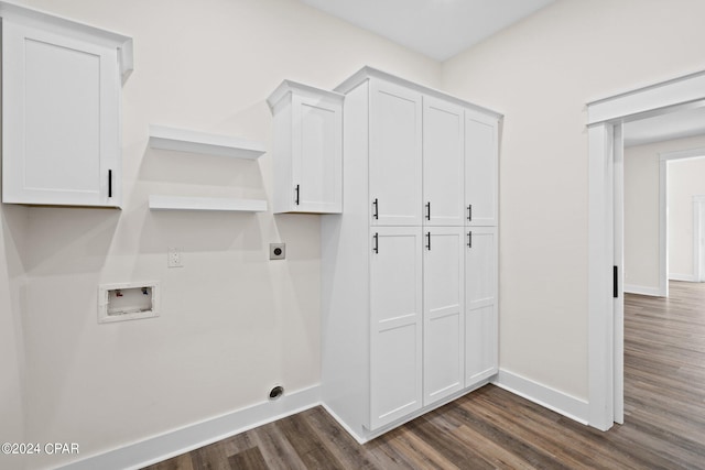 washroom featuring cabinets, hookup for a washing machine, hookup for an electric dryer, and dark hardwood / wood-style floors