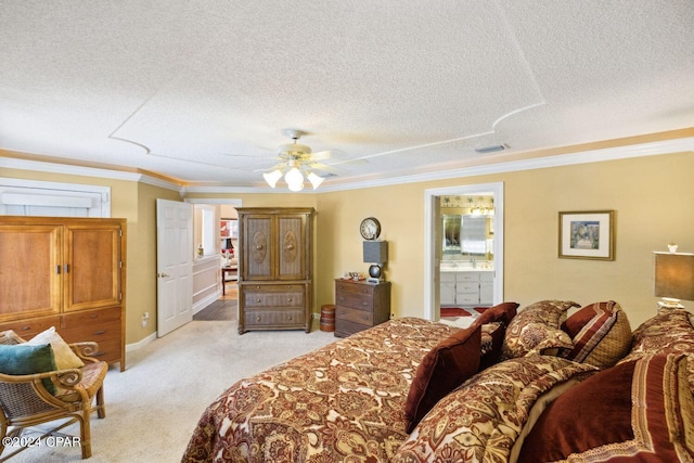 carpeted bedroom featuring crown molding, ceiling fan, a textured ceiling, and ensuite bathroom