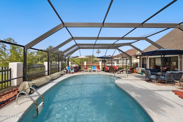 view of swimming pool featuring a patio and glass enclosure