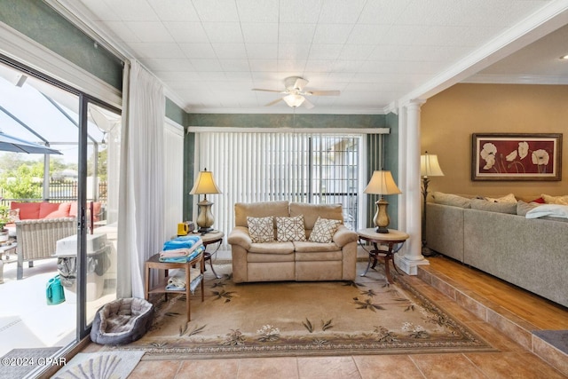 living room with ornamental molding, ceiling fan, a healthy amount of sunlight, and light wood-type flooring