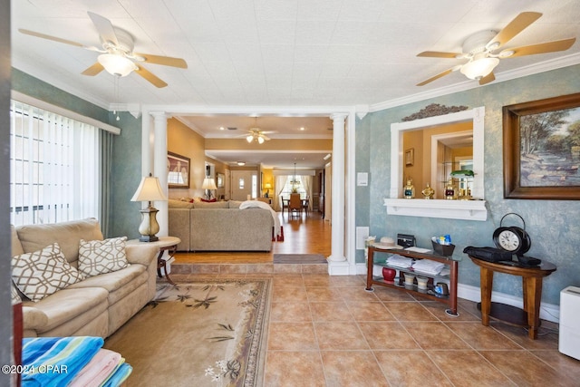 living room featuring ornate columns, ceiling fan, and ornamental molding