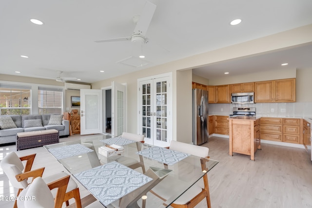 dining area featuring light hardwood / wood-style flooring and ceiling fan