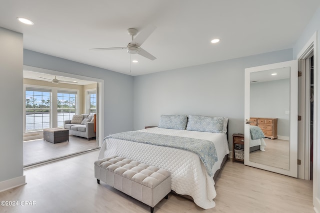 bedroom with light hardwood / wood-style flooring and ceiling fan