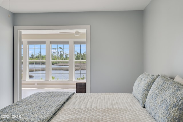 bedroom featuring a water view