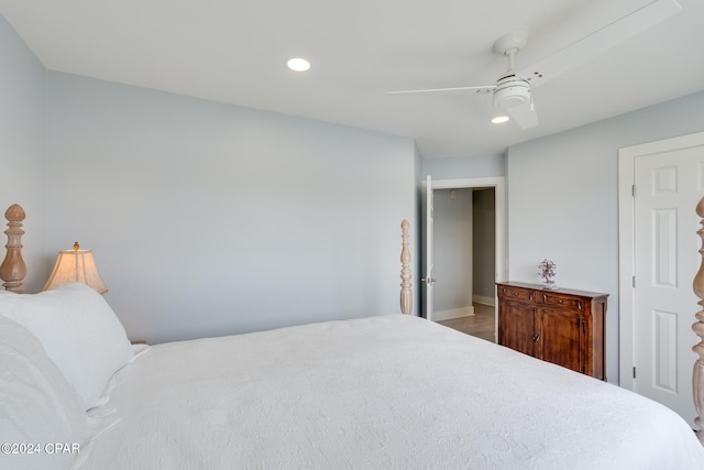 bedroom featuring wood-type flooring and ceiling fan