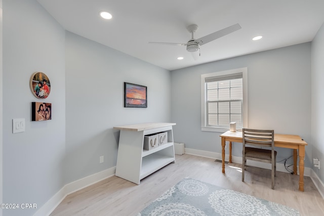 misc room featuring light hardwood / wood-style flooring and ceiling fan