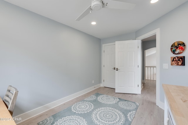 bedroom featuring ceiling fan and light hardwood / wood-style flooring