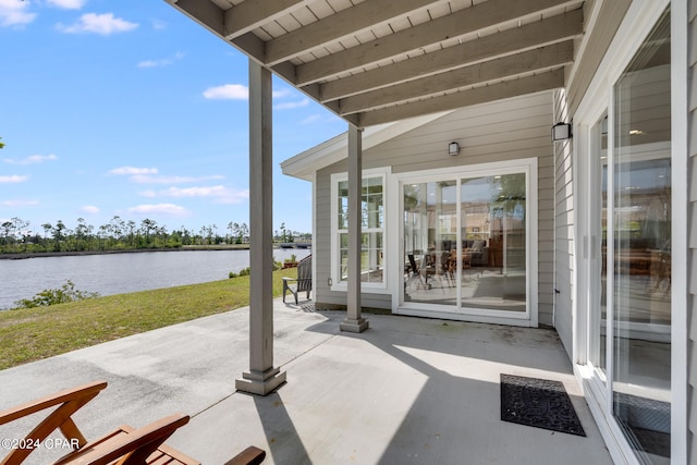 view of patio / terrace with a water view