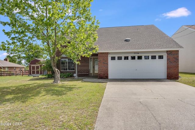 view of front of home featuring a garage and a front lawn