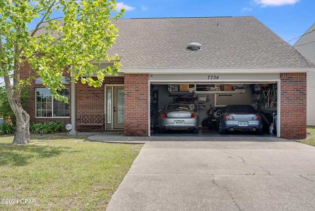 view of front of house featuring a garage and a front yard