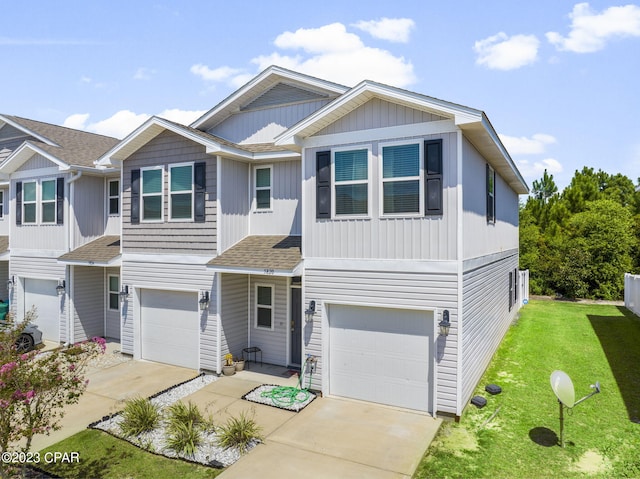 view of front of property featuring a front lawn and a garage