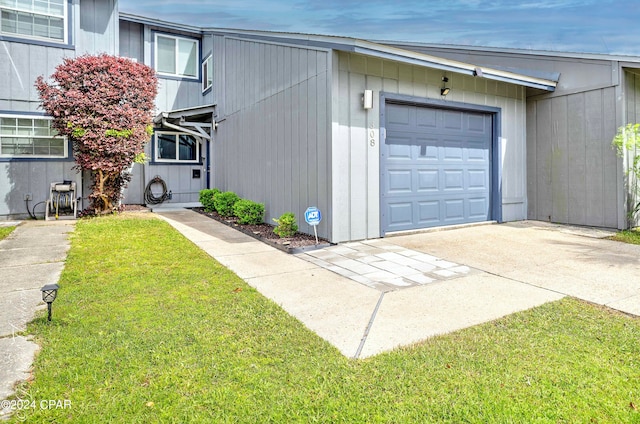 garage featuring a yard