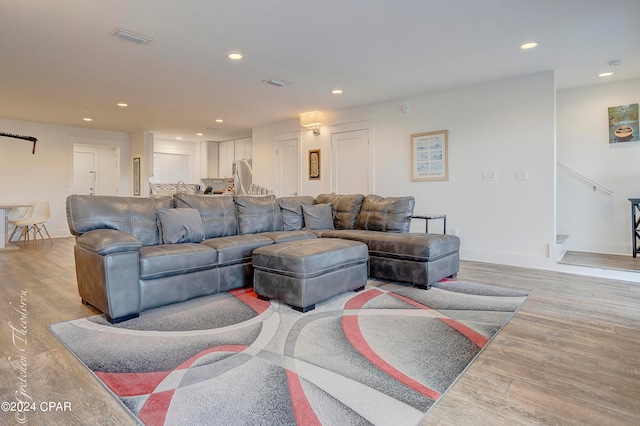 living room with light hardwood / wood-style floors