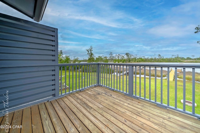 wooden terrace with a yard