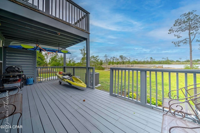 wooden deck featuring a yard