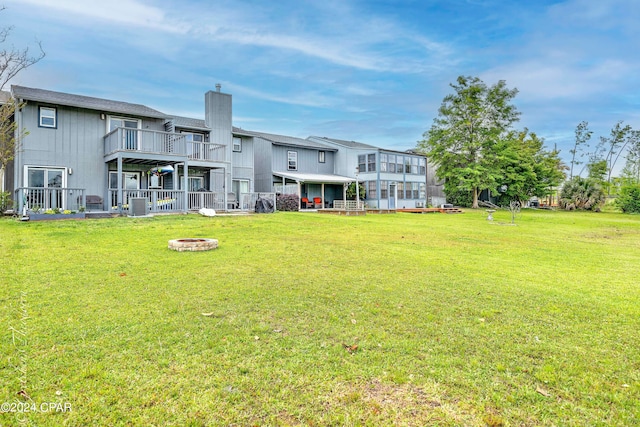 exterior space with central AC, an outdoor fire pit, and a balcony