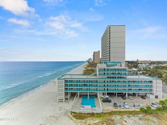 exterior space with a beach view and a water view