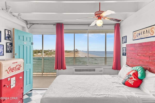 bedroom featuring light colored carpet, ceiling fan, and a water view