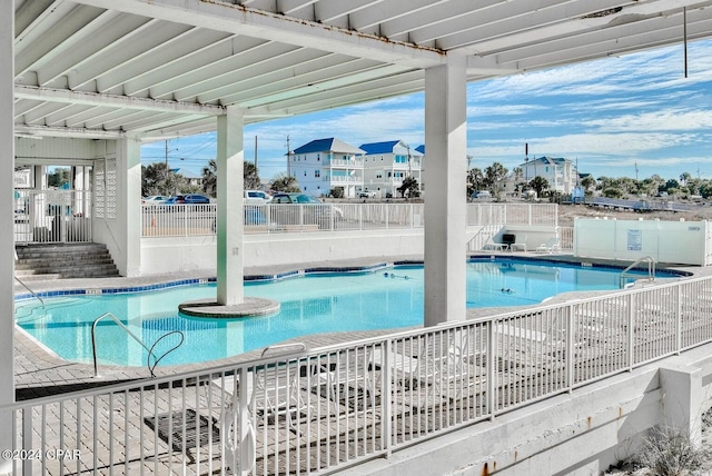 view of pool with a jacuzzi