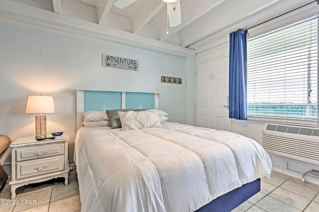 bedroom featuring ceiling fan, light tile floors, and beam ceiling