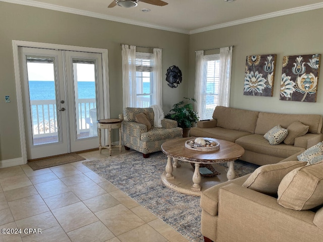 living room featuring ceiling fan, a water view, light tile floors, crown molding, and french doors