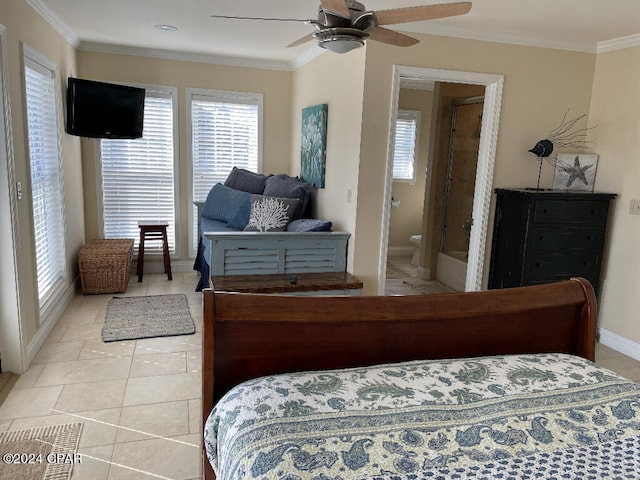 tiled bedroom with ornamental molding, ensuite bathroom, ceiling fan, and multiple windows