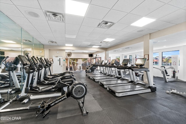 exercise room featuring a paneled ceiling