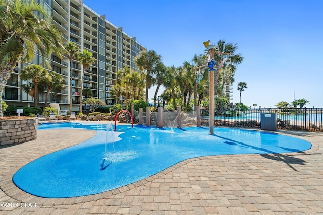 view of pool with pool water feature