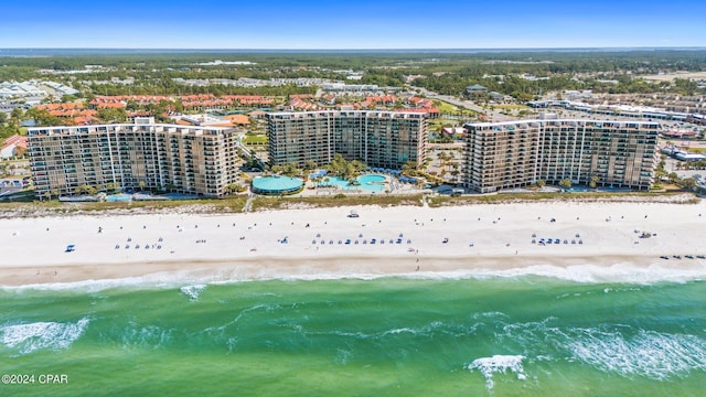 birds eye view of property featuring a view of the beach and a water view