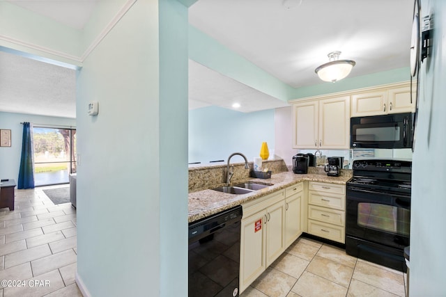 kitchen with sink, light stone countertops, light tile floors, and black appliances